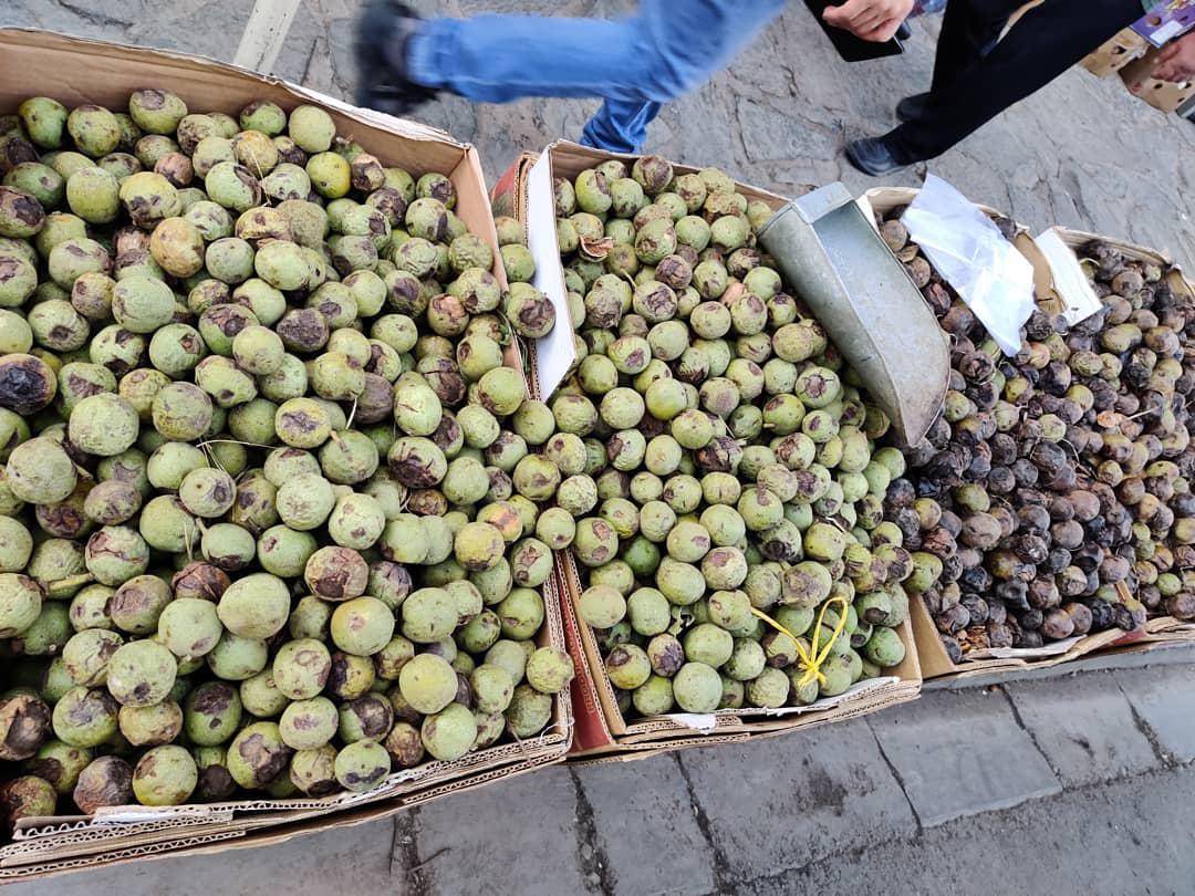 Sale of walnuts in green peel
